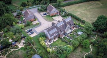 An aerial view of a small village housing development