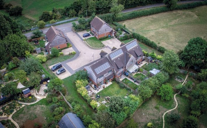 An aerial view of a small village housing development