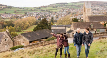 Group of teens and a young girl on a walk in the countryside in the cotswolds - greenbelt