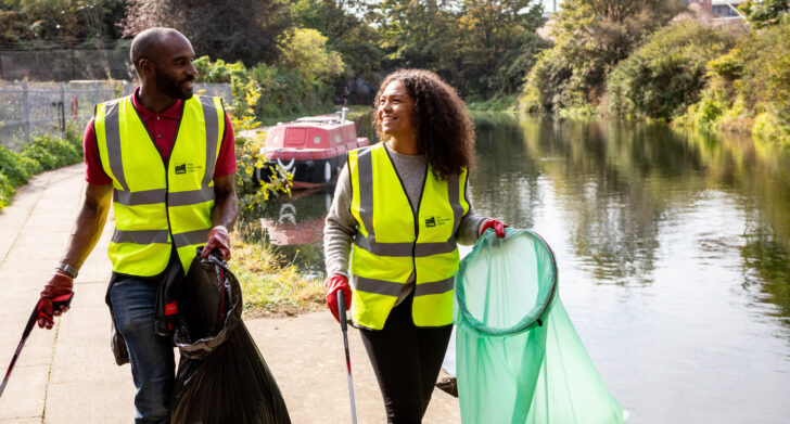 Two volunteer litter pickers