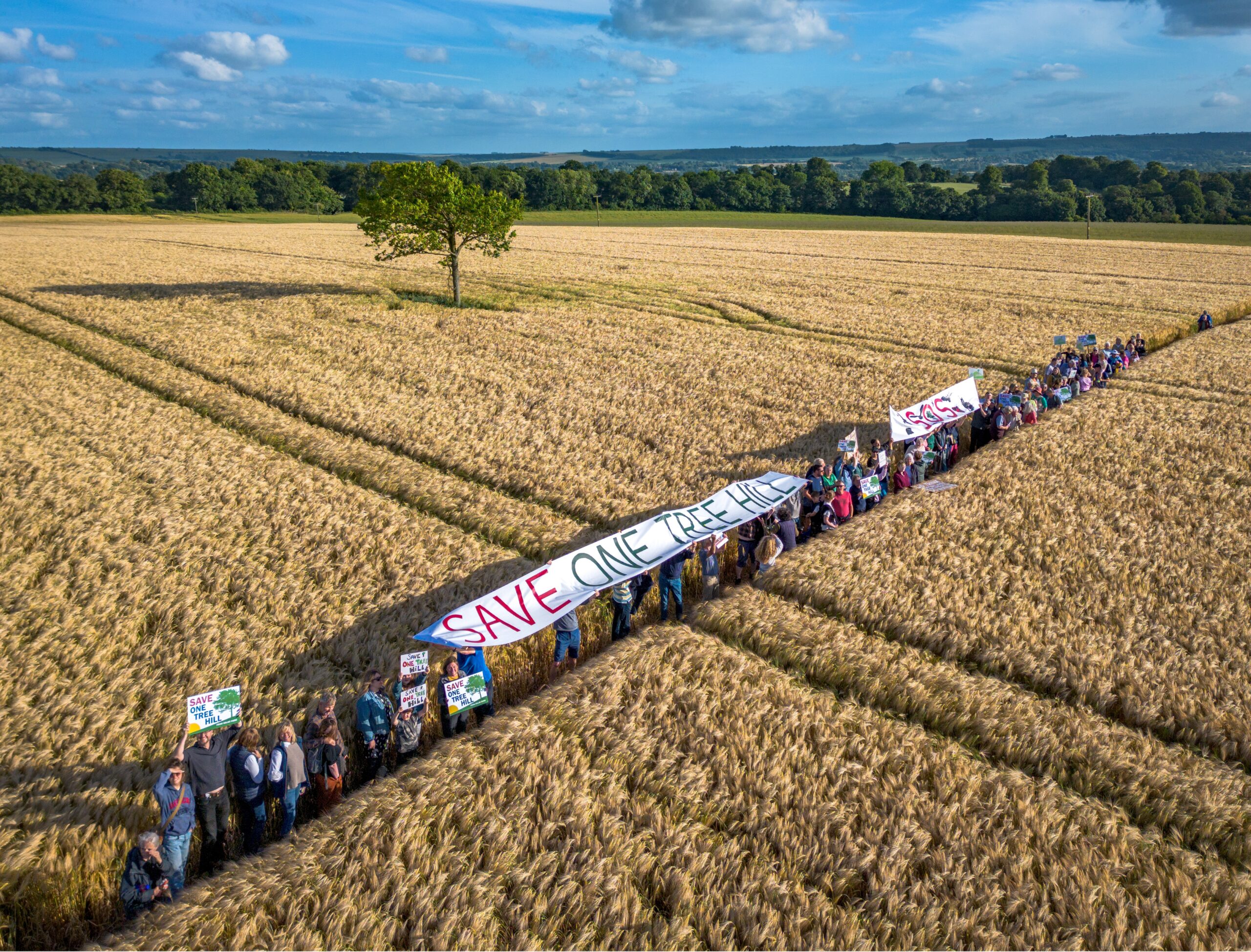 Aerial view of protestors at the proposed solar farm site at One Tree Hill, Potterne